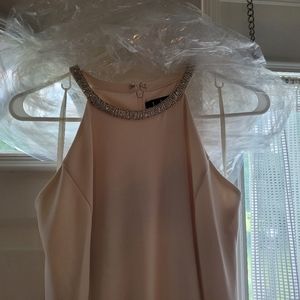 Fitted long cream dress.